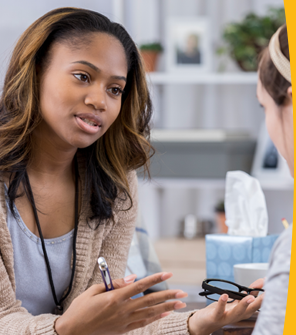 A counsellor talking to an employee.