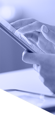 Person using a mobile phone, with a tablet nearby