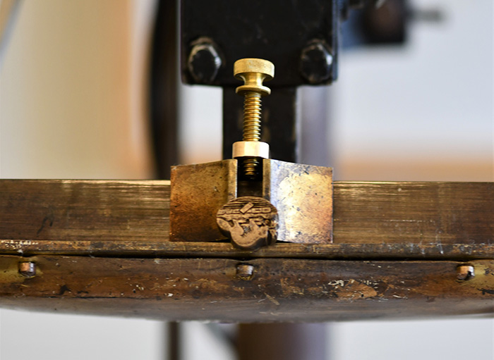 Hot press used for stamping  the beaver. When imprinting, the beaver fleuron must be placed upside down