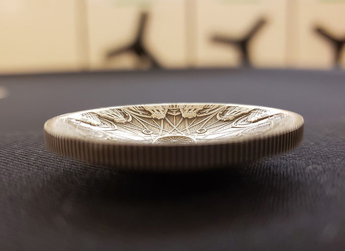 The concave shape of the 2016 coin 