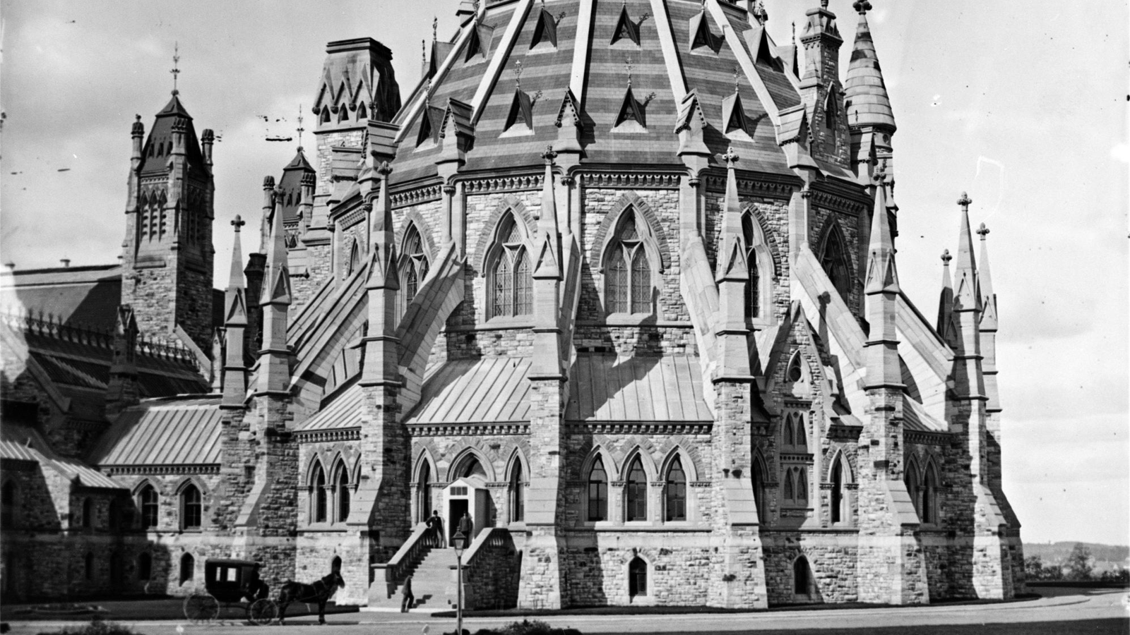 Black-and-white historical photograph of the Library of Parliament showing its original roof.