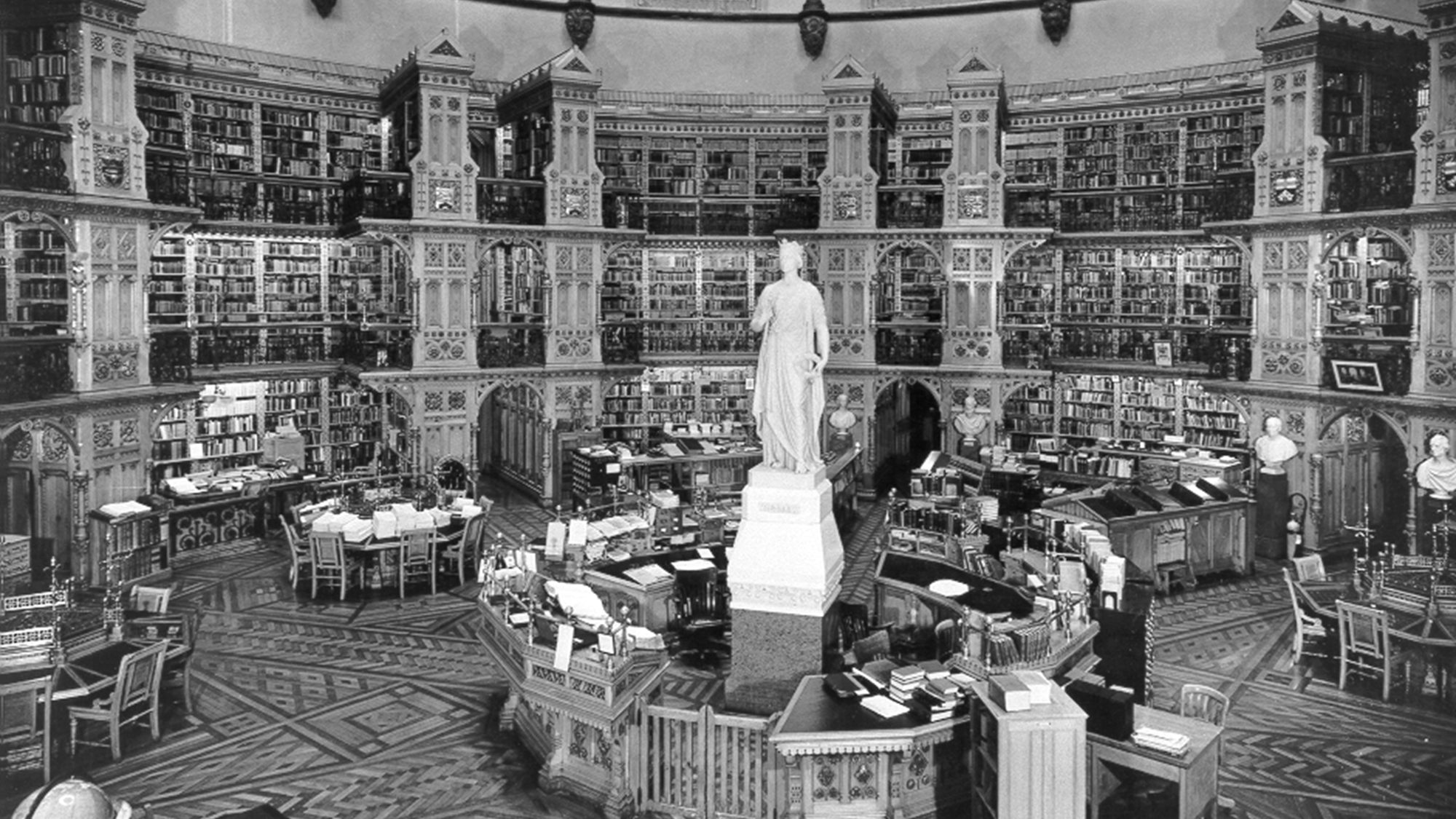 Black-and-white photograph from December 1945 showing the interior of the Library of Parliament’s circular reading room.